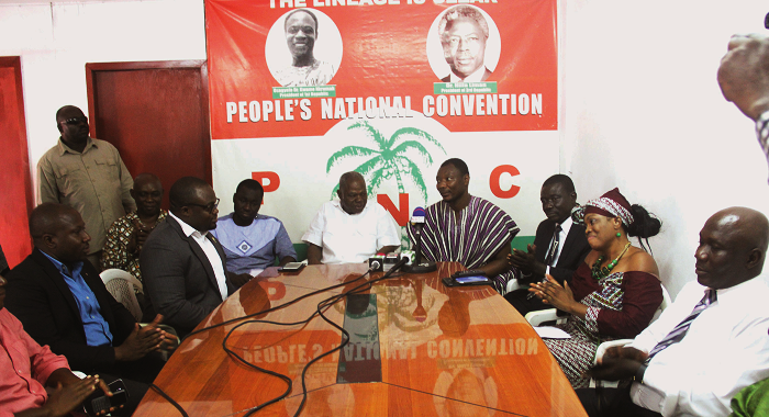 Mr Benard Mornah (in smock), PNC National Chairman, making some remarks after Mr Michael (2nd left), the immediate past president of Rotary International Accra, had presented the Four-Way Test Citation to Dr Edward Mahama (middle), the PNC presidential candidate